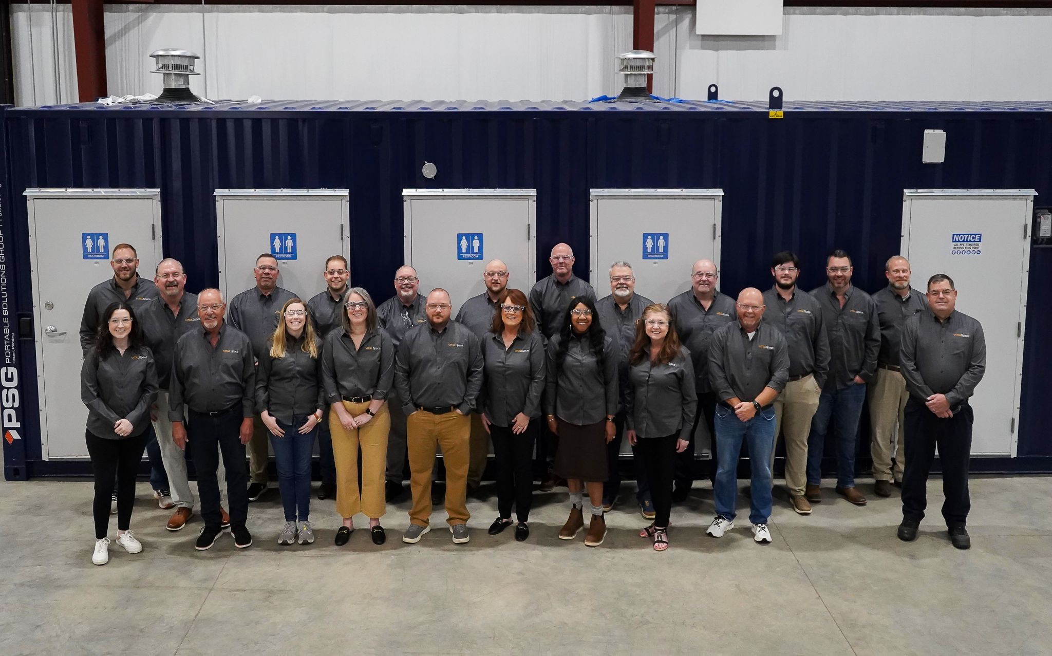 VITALSpace team pictured together at a production facility